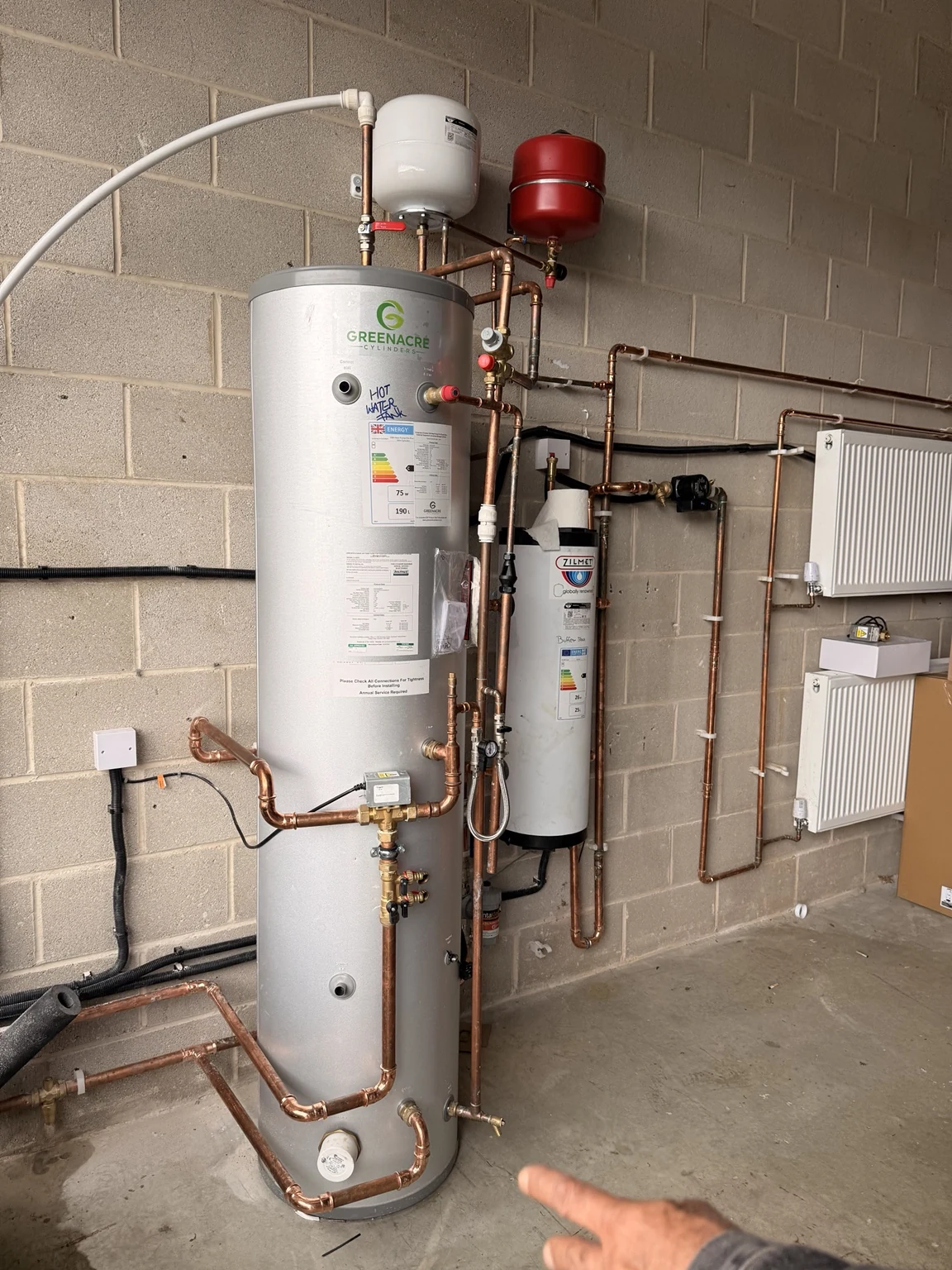 Hot-water cylinder and associated heating pipework
