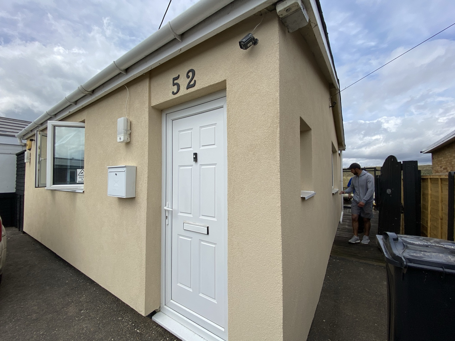 Finished rendered exterior, entrance and windows of a WorkWork bungalow insulation project